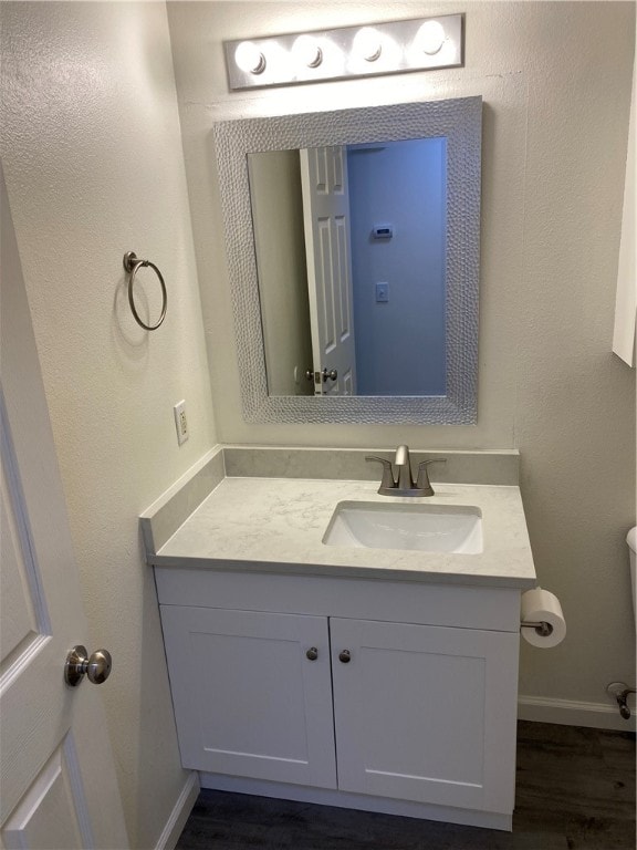 bathroom featuring vanity and hardwood / wood-style floors