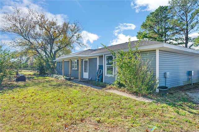 exterior space with a yard