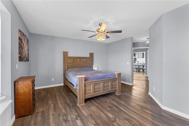 bedroom featuring ceiling fan and dark hardwood / wood-style floors