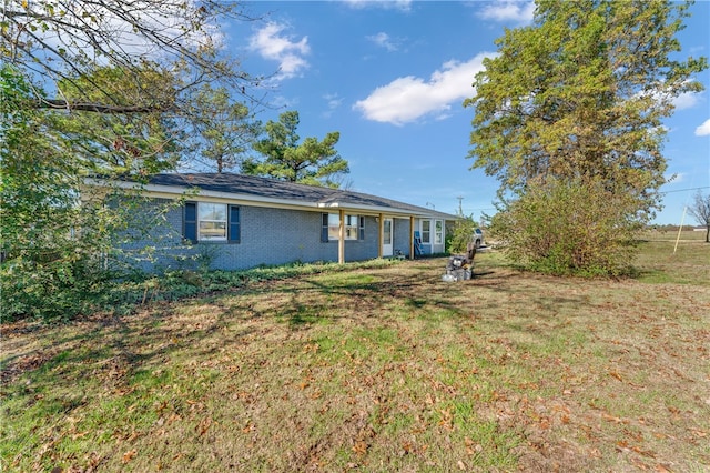 exterior space with a yard