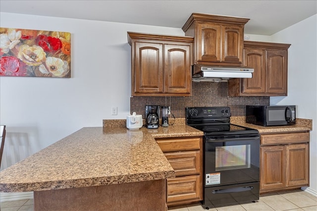 kitchen featuring decorative backsplash, black appliances, and light tile patterned floors