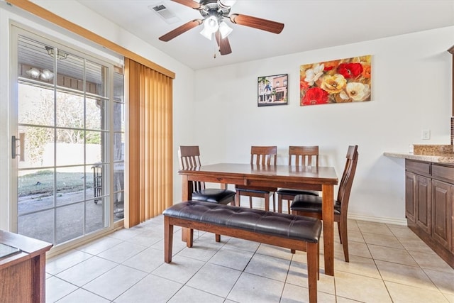 dining room with light tile patterned flooring and ceiling fan