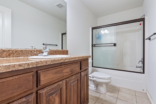 full bathroom with shower / bath combination with glass door, tile patterned flooring, toilet, and vanity