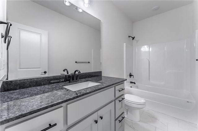 full bathroom featuring vanity, bathtub / shower combination, and toilet