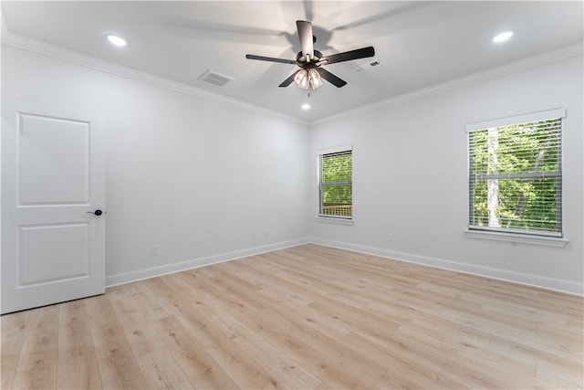 spare room featuring crown molding, ceiling fan, and light hardwood / wood-style floors