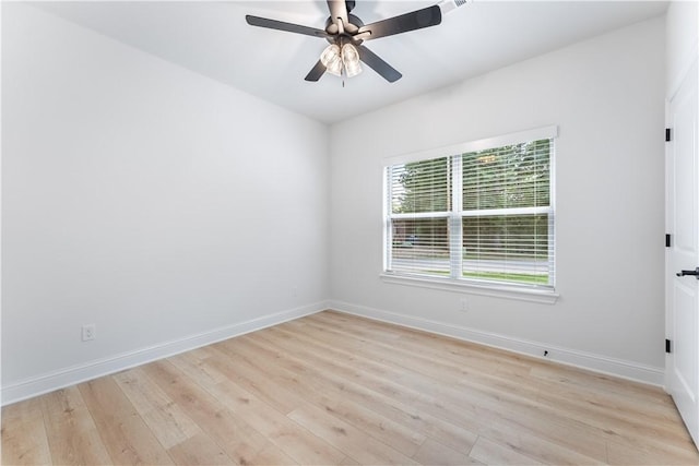 empty room featuring ceiling fan and light hardwood / wood-style floors