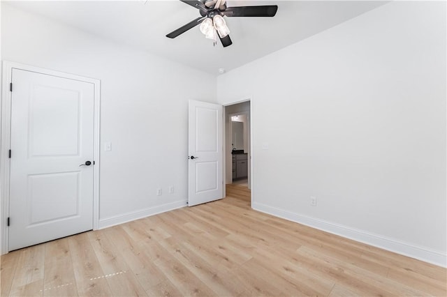 unfurnished bedroom with ceiling fan and light hardwood / wood-style flooring