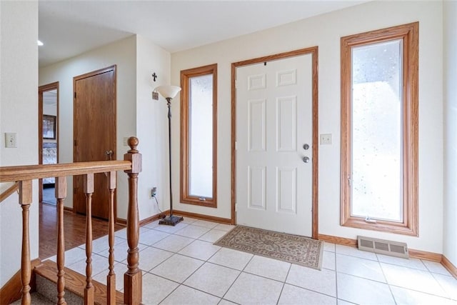 entrance foyer featuring light tile patterned floors