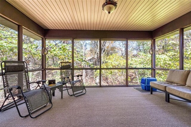 unfurnished sunroom with wooden ceiling