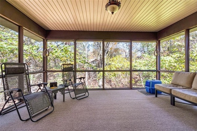 unfurnished sunroom featuring wood ceiling