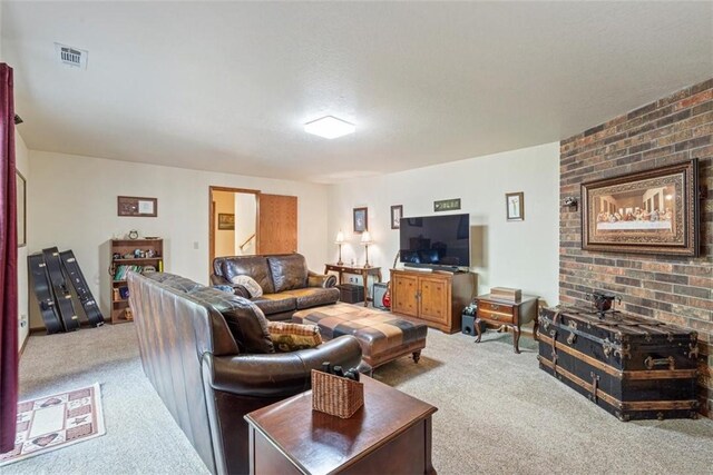 carpeted living room with a textured ceiling