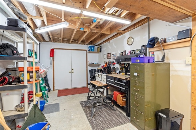 basement with a workshop area