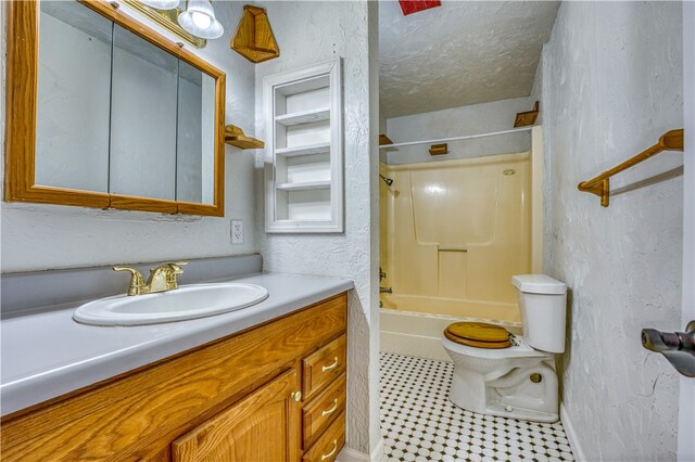 full bathroom featuring vanity, toilet, a textured ceiling, and shower / bathing tub combination