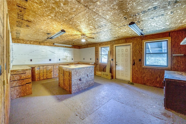 kitchen featuring ceiling fan and a kitchen island