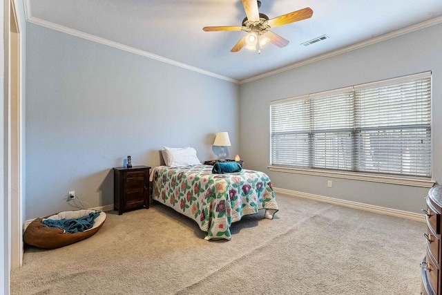 bedroom with a ceiling fan, visible vents, baseboards, ornamental molding, and carpet