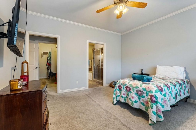 carpeted bedroom featuring baseboards, connected bathroom, a ceiling fan, and crown molding