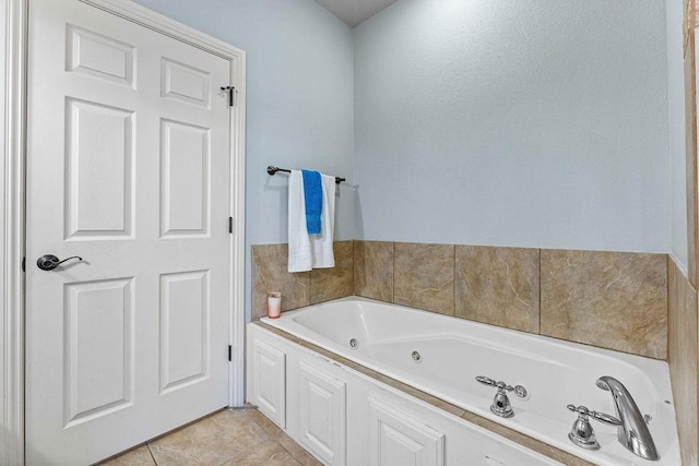 bathroom featuring a jetted tub and tile patterned floors