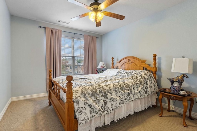 carpeted bedroom featuring baseboards, visible vents, and ceiling fan