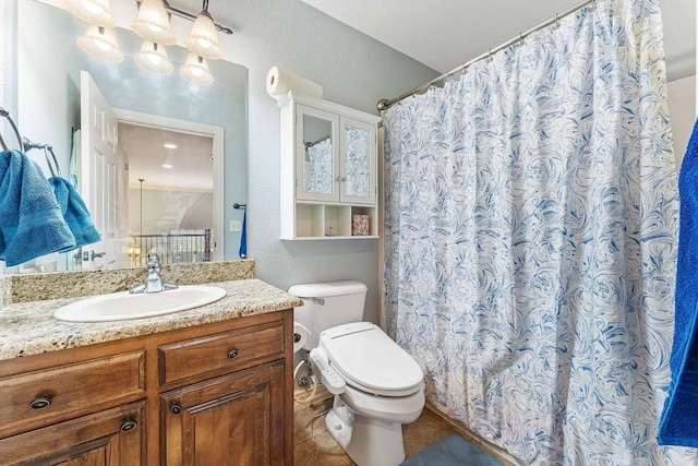 full bathroom featuring a textured wall, toilet, a shower with shower curtain, tile patterned floors, and vanity