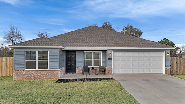 single story home with a garage and a front yard