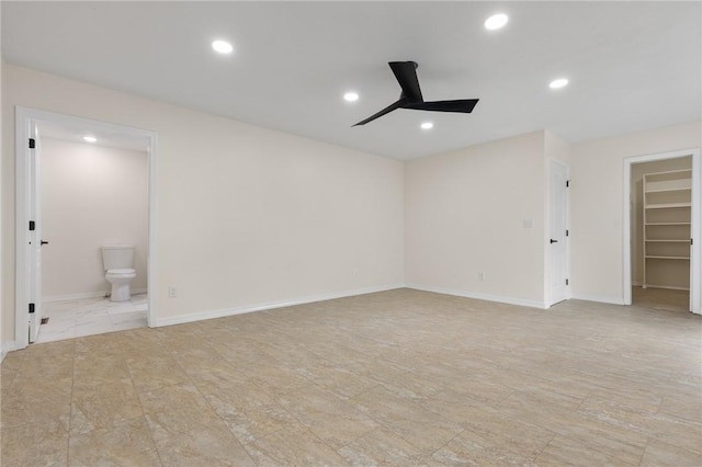spare room with a ceiling fan, recessed lighting, and baseboards