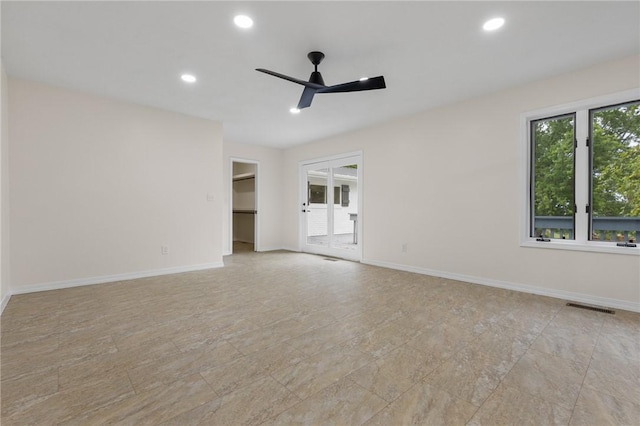 spare room featuring visible vents, recessed lighting, ceiling fan, and baseboards