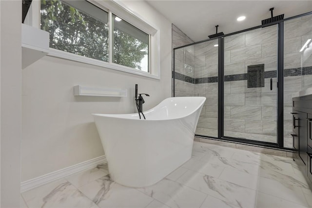 bathroom featuring a freestanding tub, a shower stall, marble finish floor, and baseboards