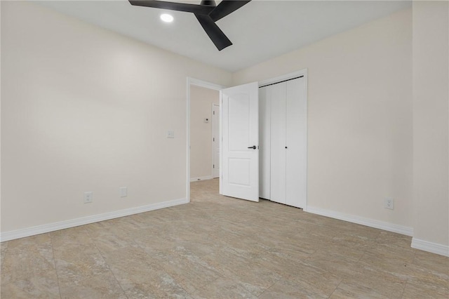 unfurnished bedroom with ceiling fan and a closet