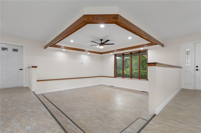 spare room with beam ceiling, a ceiling fan, recessed lighting, and baseboards