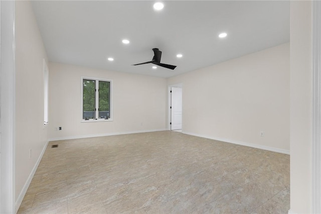 empty room with visible vents, a ceiling fan, recessed lighting, and baseboards