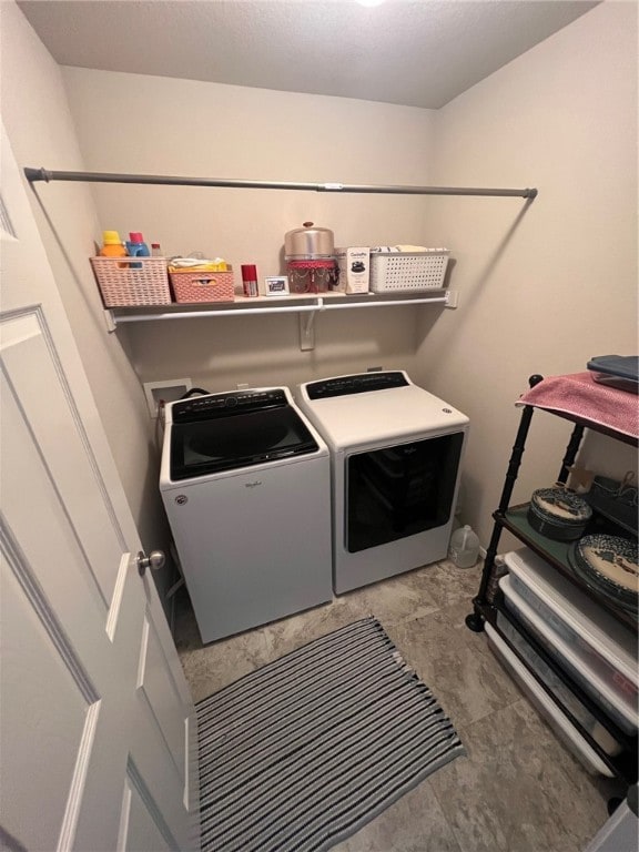 laundry room with separate washer and dryer