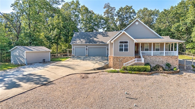 view of front of house with a porch and an outdoor structure