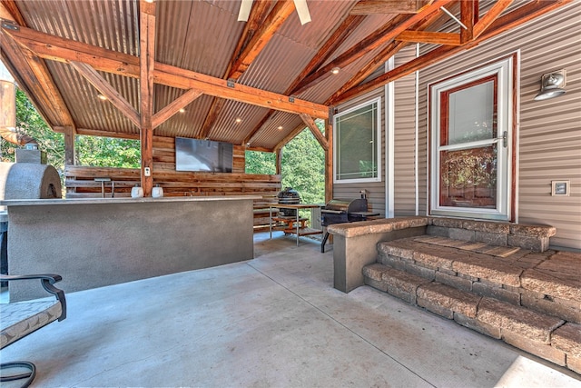 view of patio featuring area for grilling and exterior bar