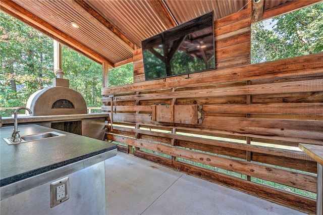 view of patio with sink and exterior kitchen