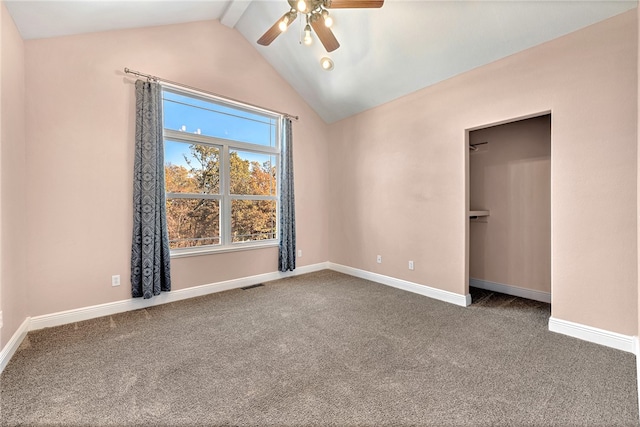 unfurnished bedroom with vaulted ceiling with beams, ceiling fan, and carpet