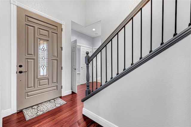 foyer entrance with dark wood-type flooring