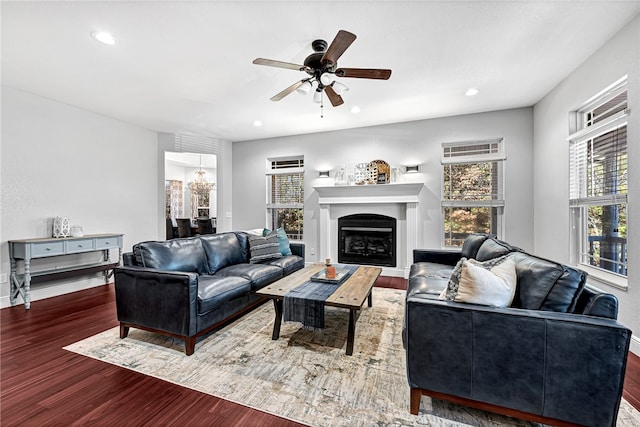 living room with hardwood / wood-style flooring and ceiling fan