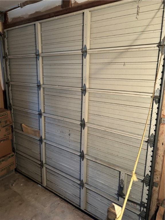 garage featuring wood walls