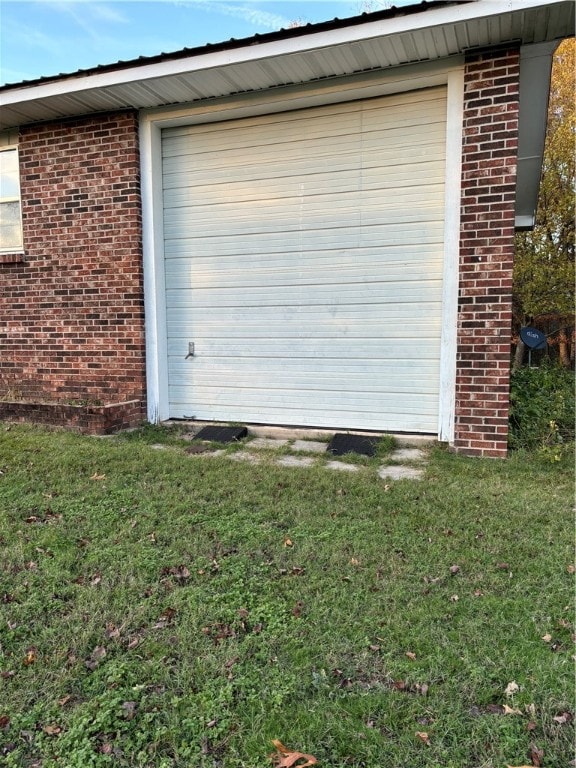 garage featuring a lawn