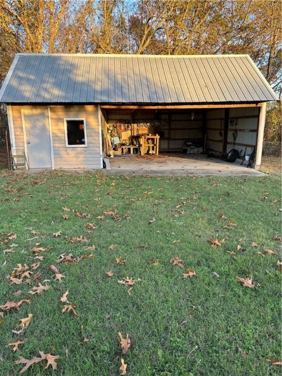 view of outdoor structure with a lawn