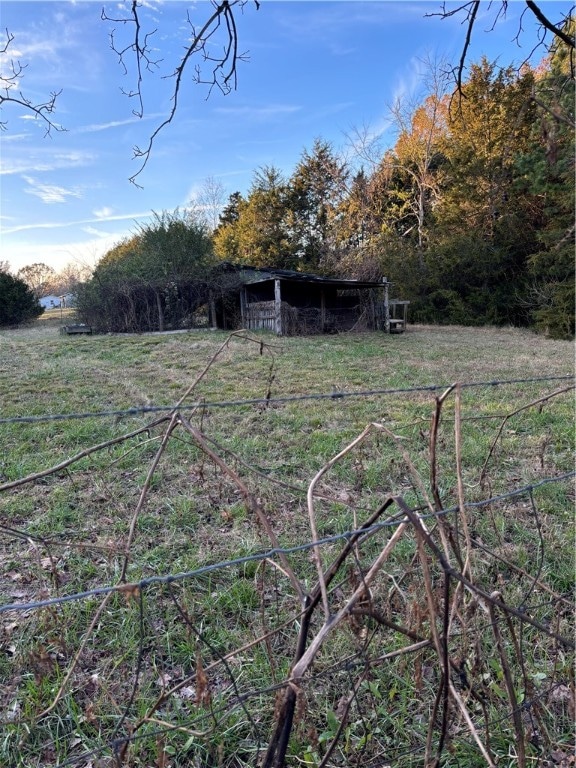 view of yard with a rural view