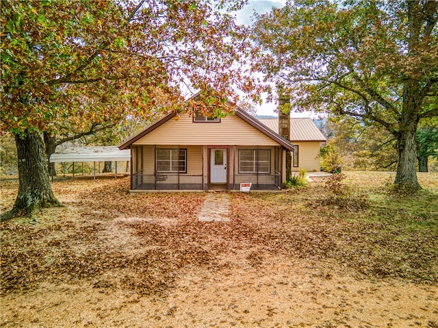 single story home with a carport