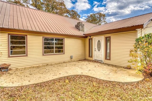 entrance to property with a patio area