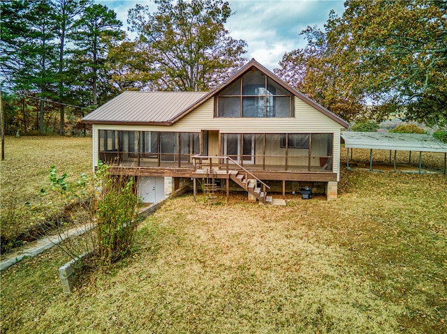 back of property with a trampoline, a yard, and a sunroom