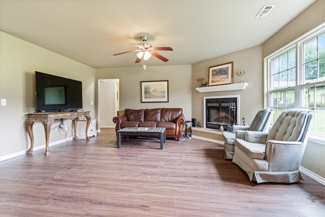 living room with hardwood / wood-style floors and ceiling fan