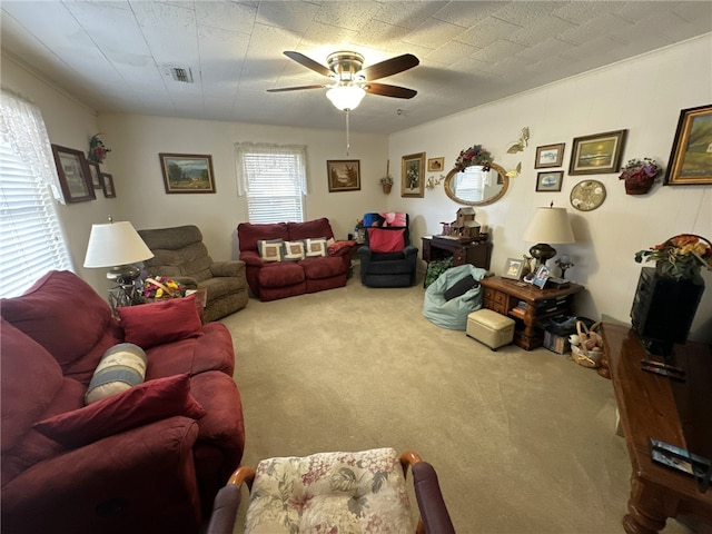 living room featuring carpet floors and ceiling fan