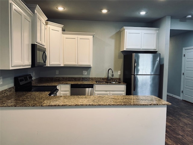 kitchen featuring sink, stainless steel appliances, and white cabinets