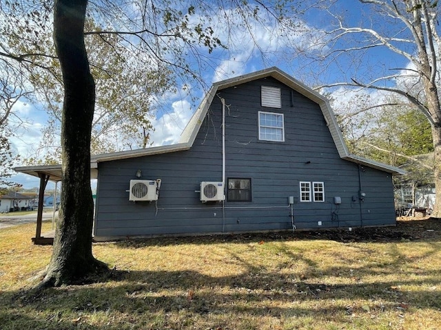 view of property exterior with a yard and ac unit