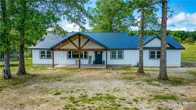 view of front of home with a trampoline