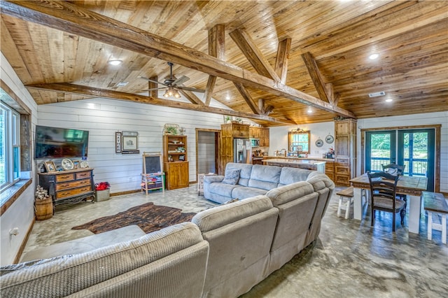 living room featuring lofted ceiling with beams, ceiling fan, wood ceiling, and french doors